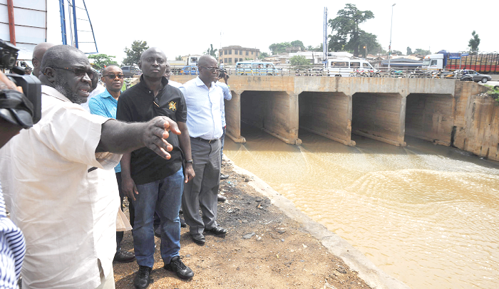 Mr Samuel Atta Akyea (2nd right) and some officials from his outfit looking at the drain at Avenor during the tour. Picture: EMMANUEL QUAYE Mr Samuel Atta Akyea (2nd right) and some officials from his outfit looking at the drain at Avenor during the tour. Picture: EMMANUEL QUAYE